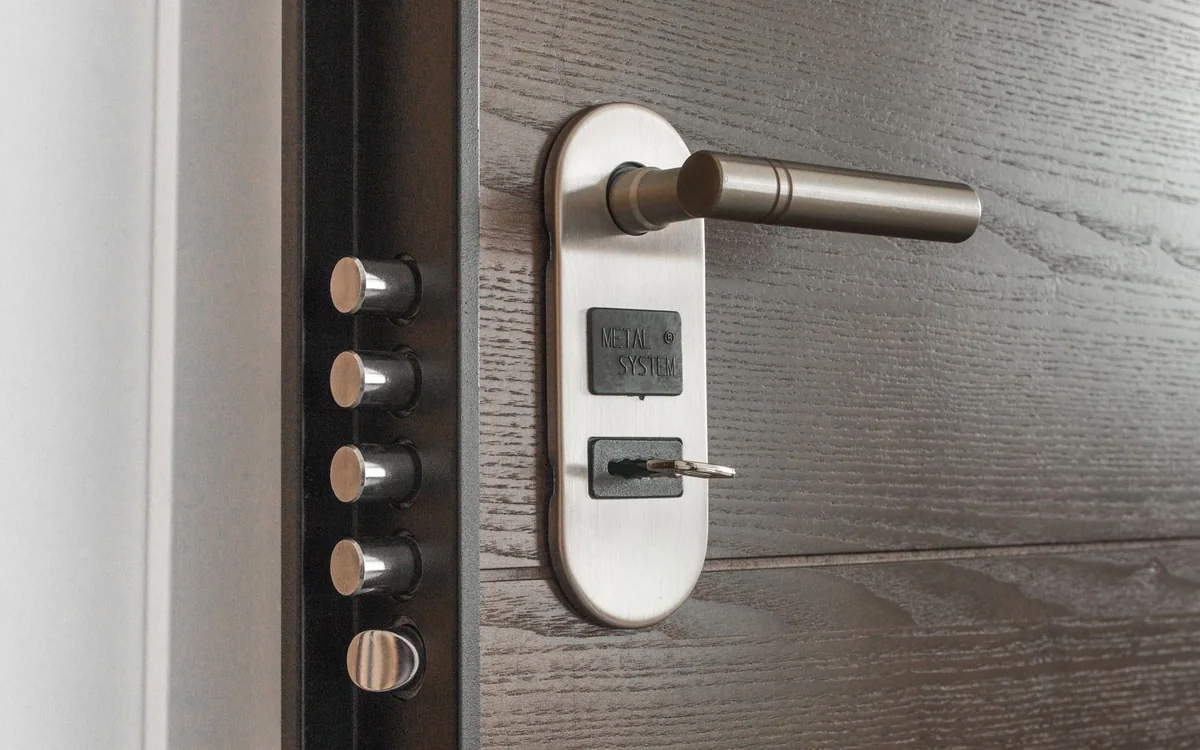 A homeowner setting up temporary access codes for a guest on a phone